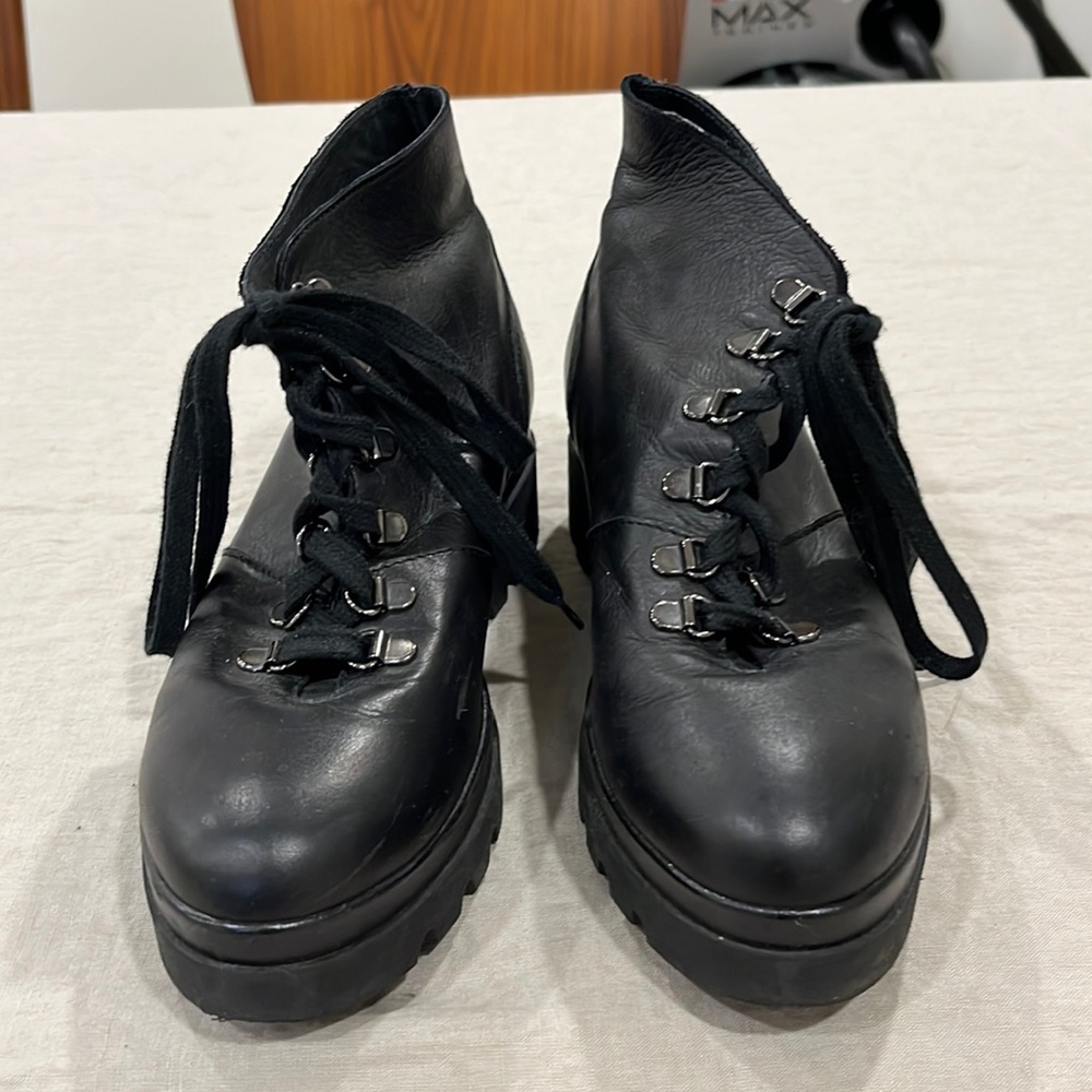 Barney’s black combat boots